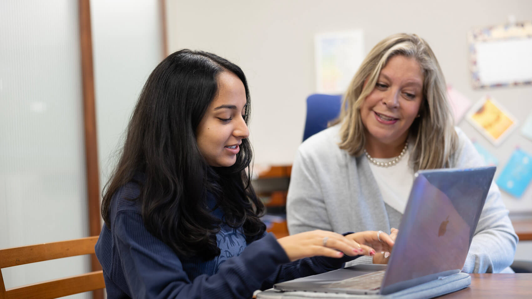 A health science student discusses career options with an academic advisor.