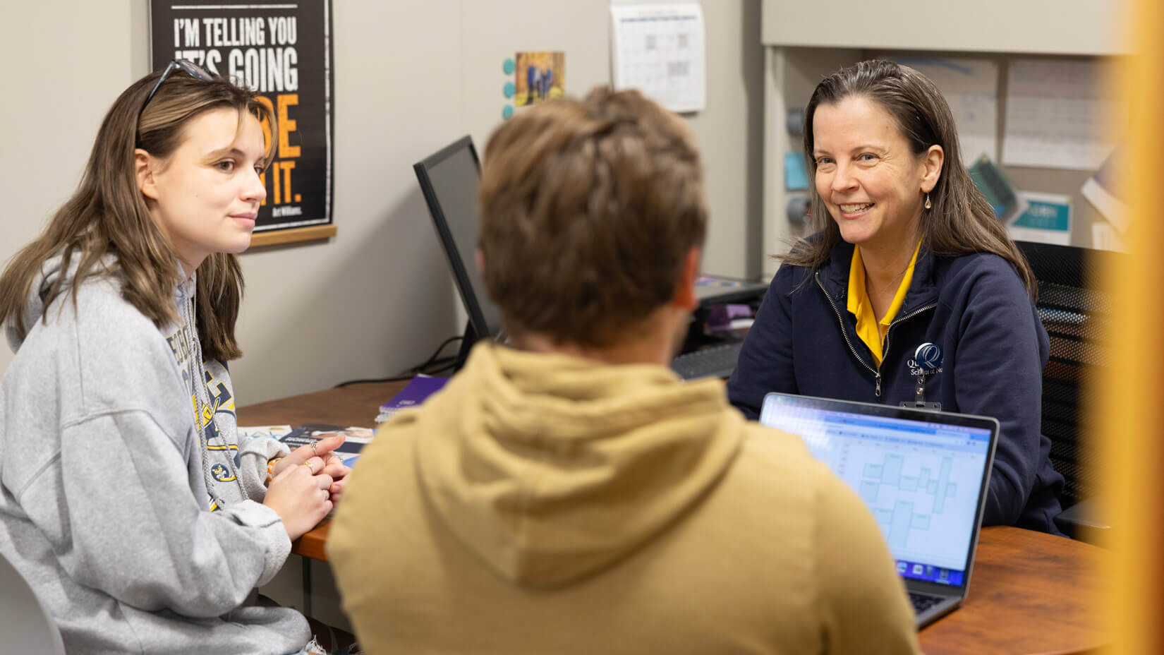 Nursing students participate in an academic advisory session.